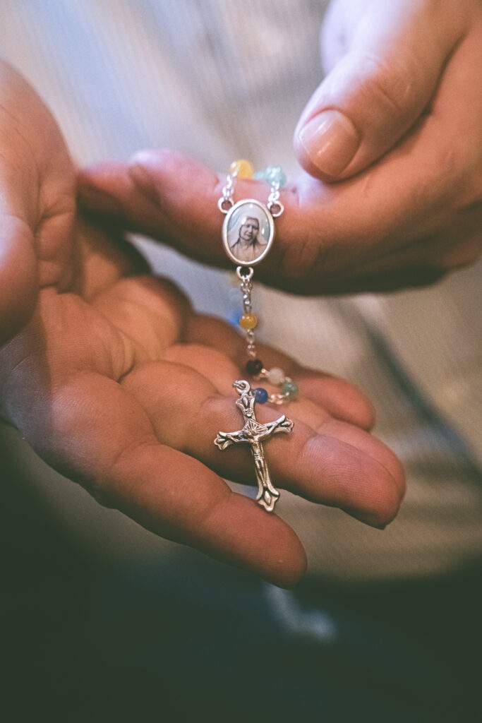 Jacob shows a rosary.