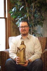 Jacob holds statue of Blessed Mother Maria Teresa Casini