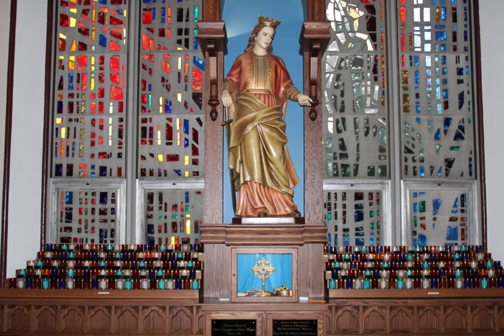 St. Dymphna Statue with relic and candles