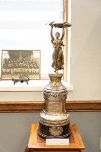 golden trophy on display in the 80th anniversary exhibit