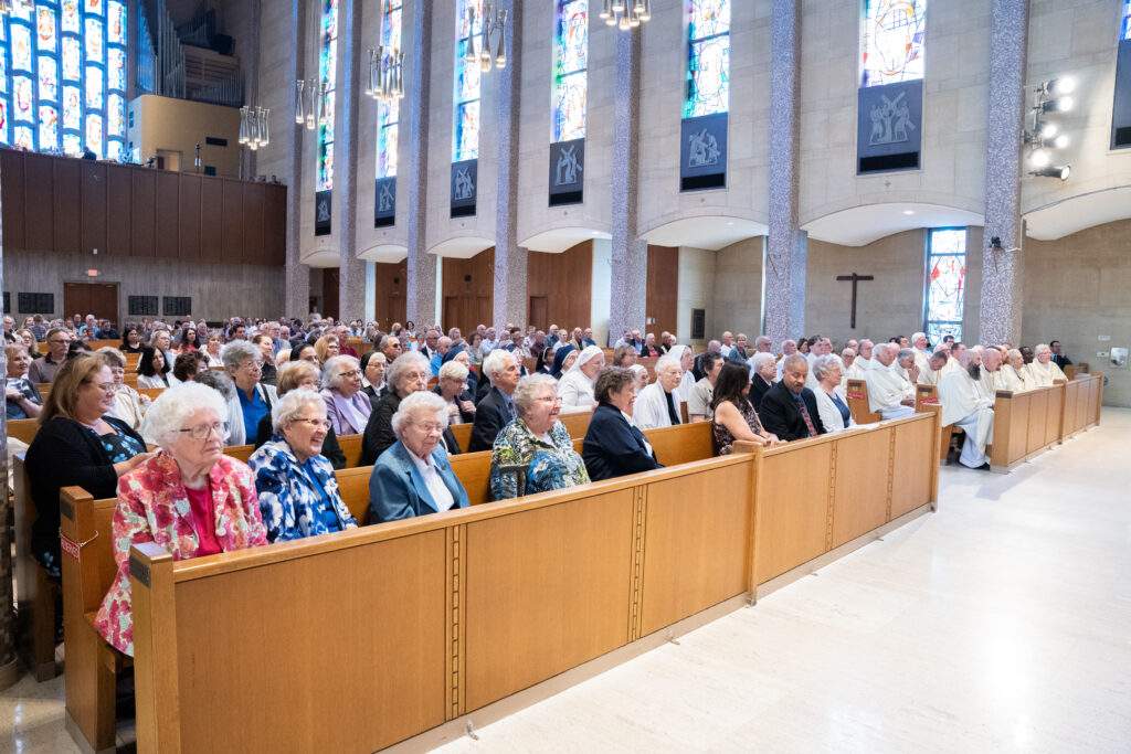 Full pews at 80th anniversary Mass
