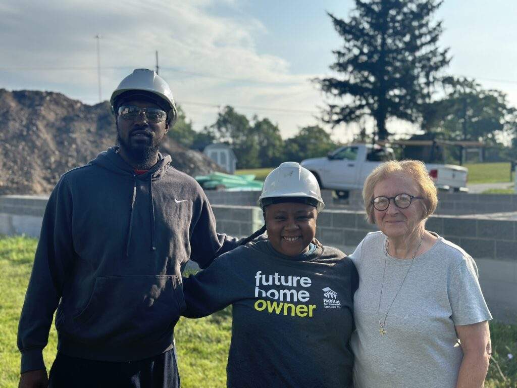 The Mathises pose with Sister Carolyn