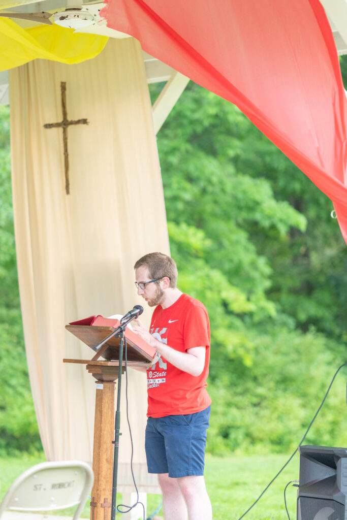 Young man does reading at Mass