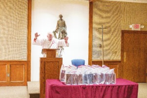 Deacon Ron Layko from St. Christine Parish performs the All Souls Remembrance Service for unclaimed cremated remains. Photo by Jimmy Joe Savage.