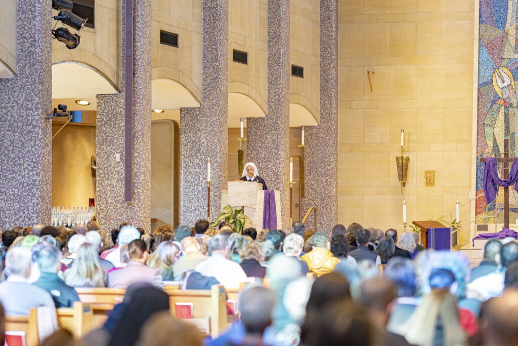 A religious sister performs a reading at the Rite of Election in 2024. Photo by Brian Keith.