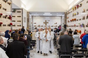 Participants stand during the recessional hymn at St. Callistus Feast Day on October 14, 2024, at Calvary Cemetery in Massillon.