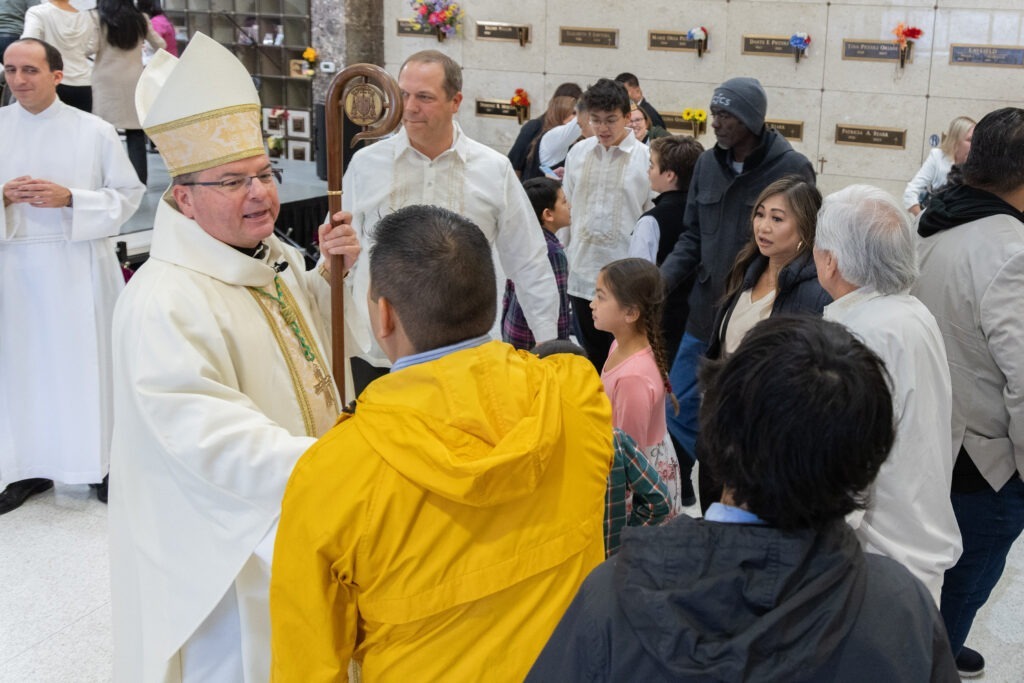 Bishop Bonnar greets guests at St. Callistus Feast Day on October 14, 2024, at Calvary Cemetery in Massillon.