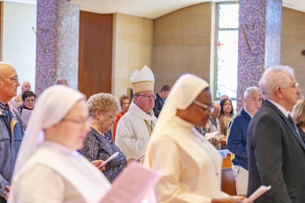 Bishop Bonnar processes down the aisle of St. Columba Cathedral during Holy Thursday 2024. Photo by Brian Keith.