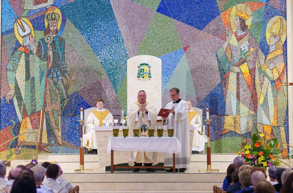 Bishop consecrates the oil of the sick. Photo by Jimmy Joe Savage. Chrism Mass 2024.