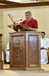 Cantor leads the congregation in song at the Good Friday Liturgy 2024 at Our Lady of Peace Parish in Ashtabula. Photo by Marilou McClimans.