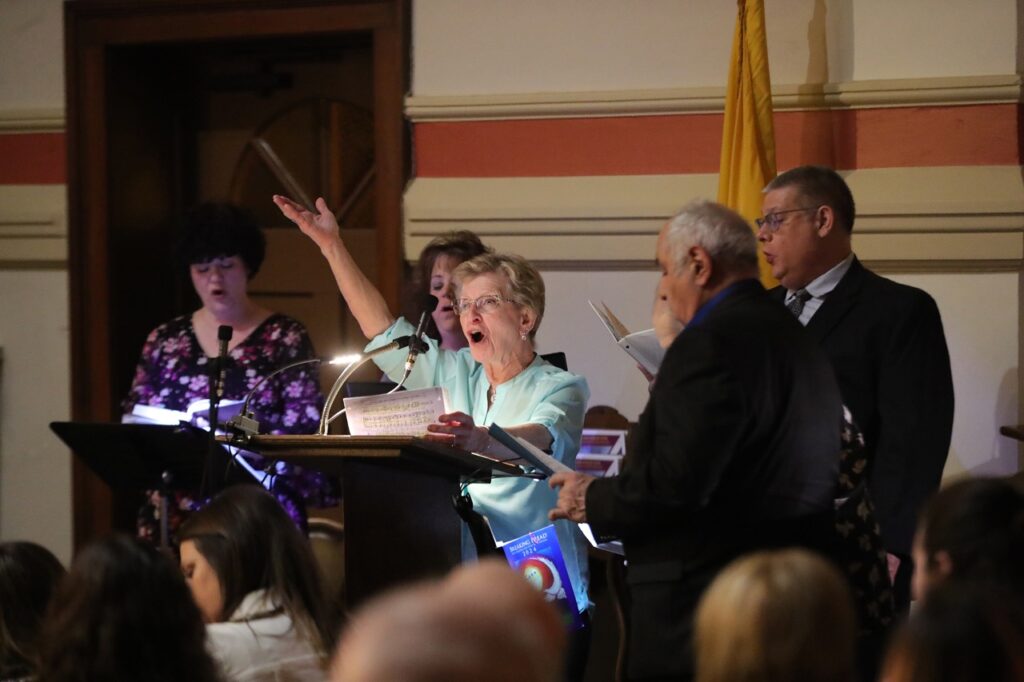 Cantor leads the choir and congregation in song at St. Joseph Parish in Mogadore during the Easter Vigil 2024. Photo by Ed Hall, Jr.
