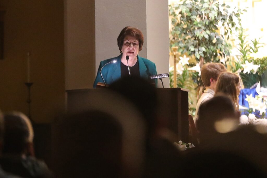 Female lector stands and the ambo at St. Joseph Parish in Mogadore during the Easter Vigil 2024. Photo by Ed Hall, Jr.