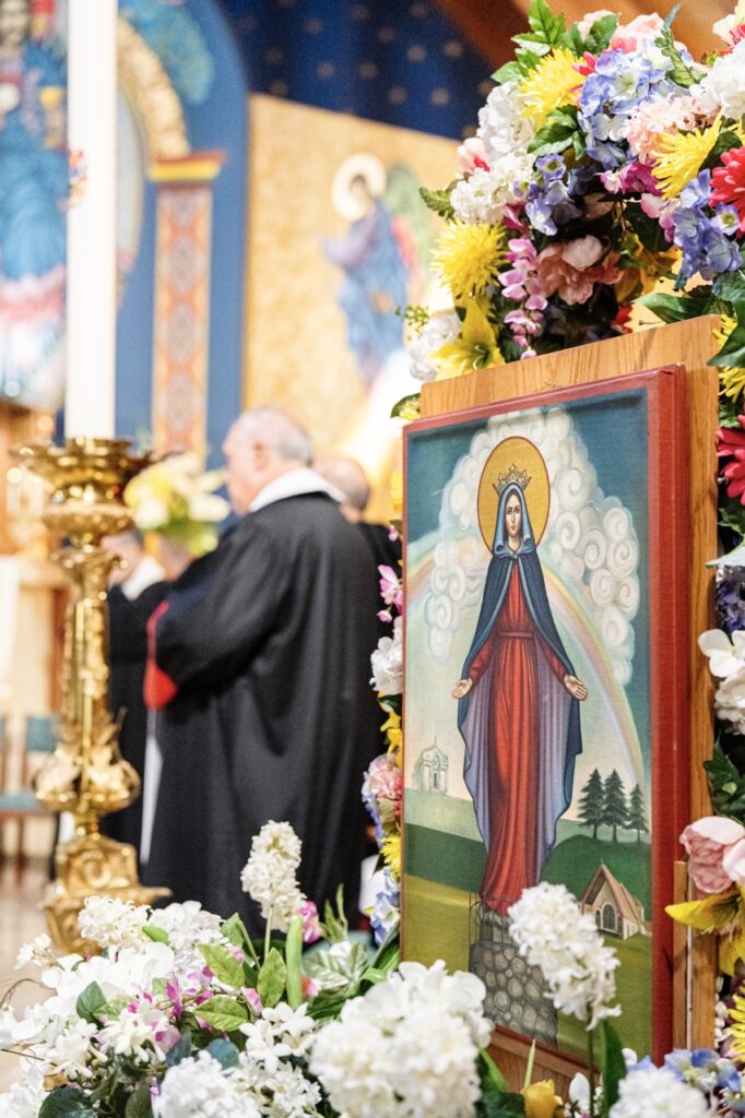 Our Lady of Lebanon, surrounded by flowers for the Assumption Pilgrimage in North Jackson. Photo by Brian Keith.