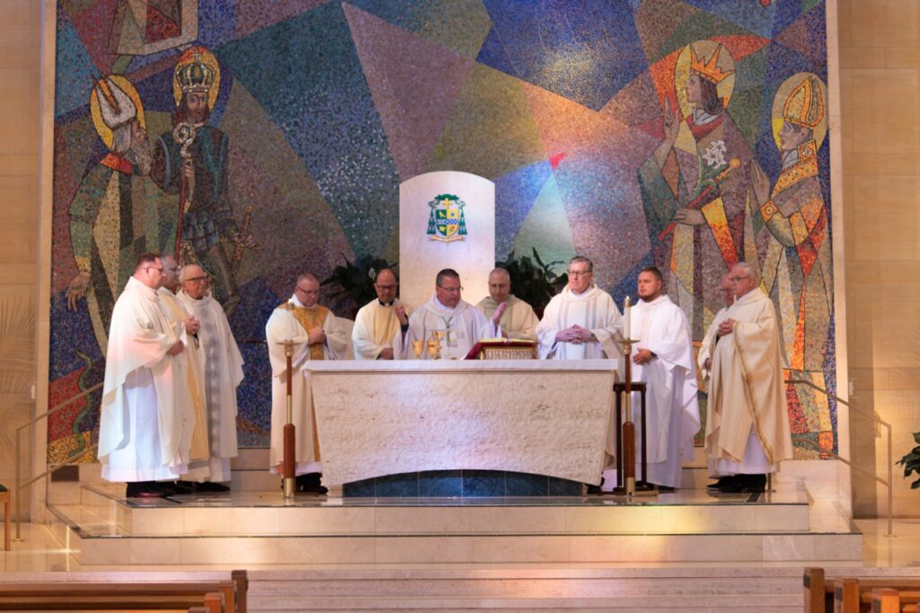 Bishop Bonnar performs the Eucharistic Prayers, surrounded by fellow clergy. Photo by Courtney Poullas