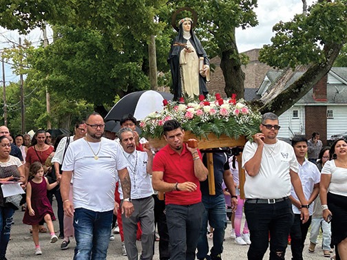 People process with a statue of Santa Rose de Lima