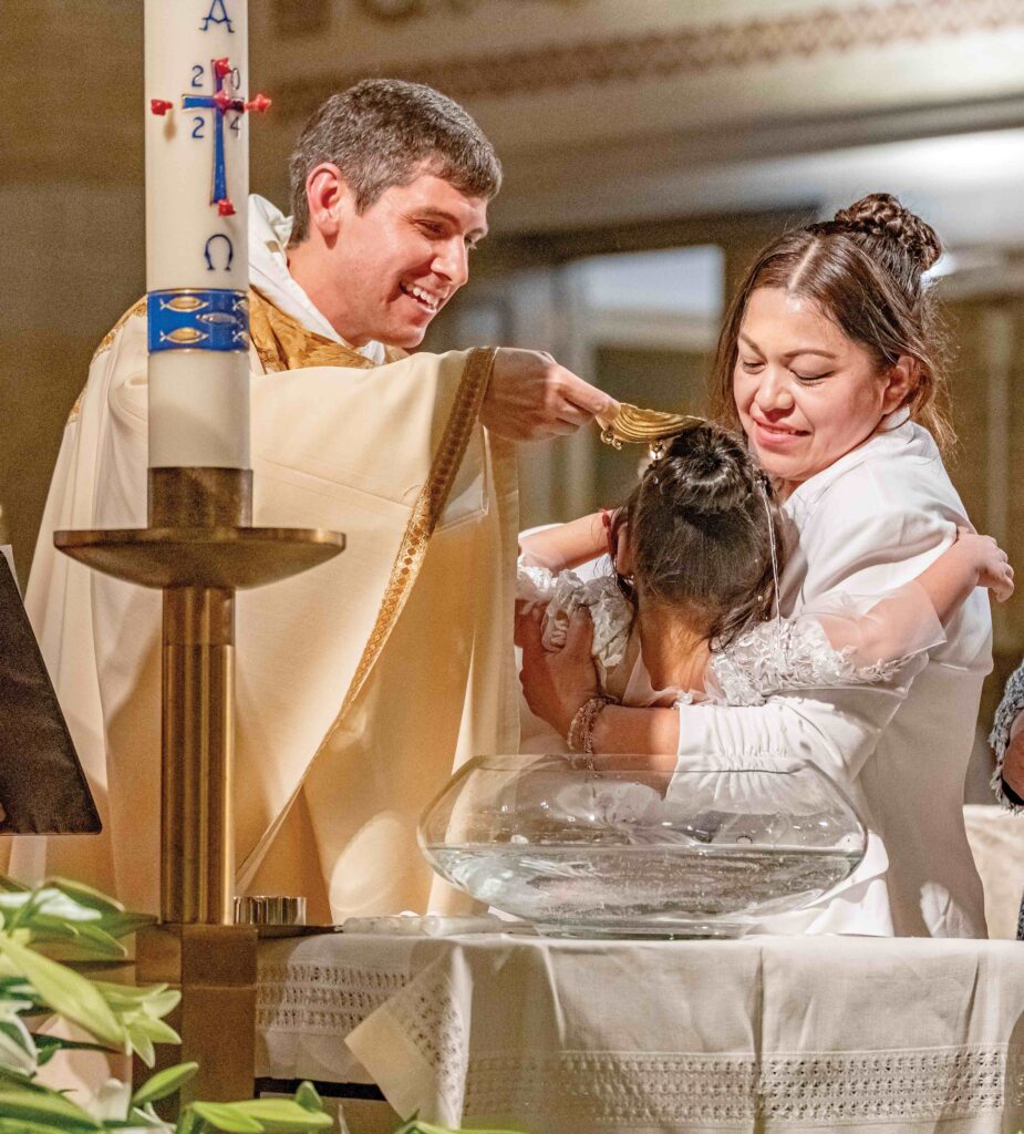 Child is baptized at St. Dominic Parish