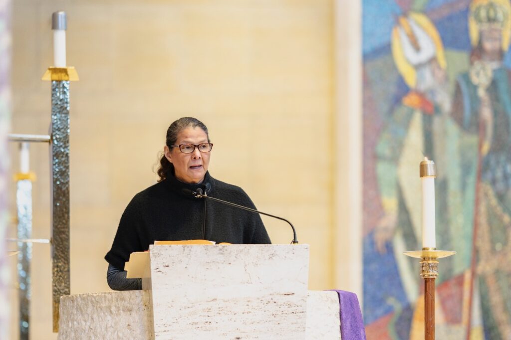 Woman does the second reading during the Rite of Election. Photo by Brian Keith.