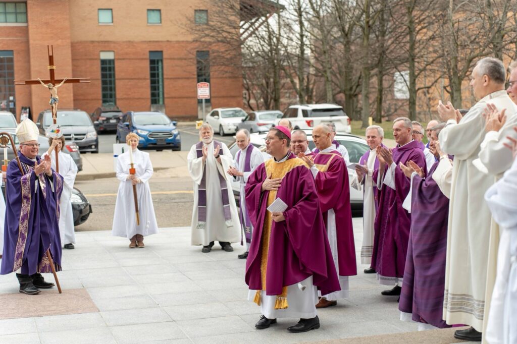 Bishop-elect greets his brother priests and bishop bonnar after his farewell mass