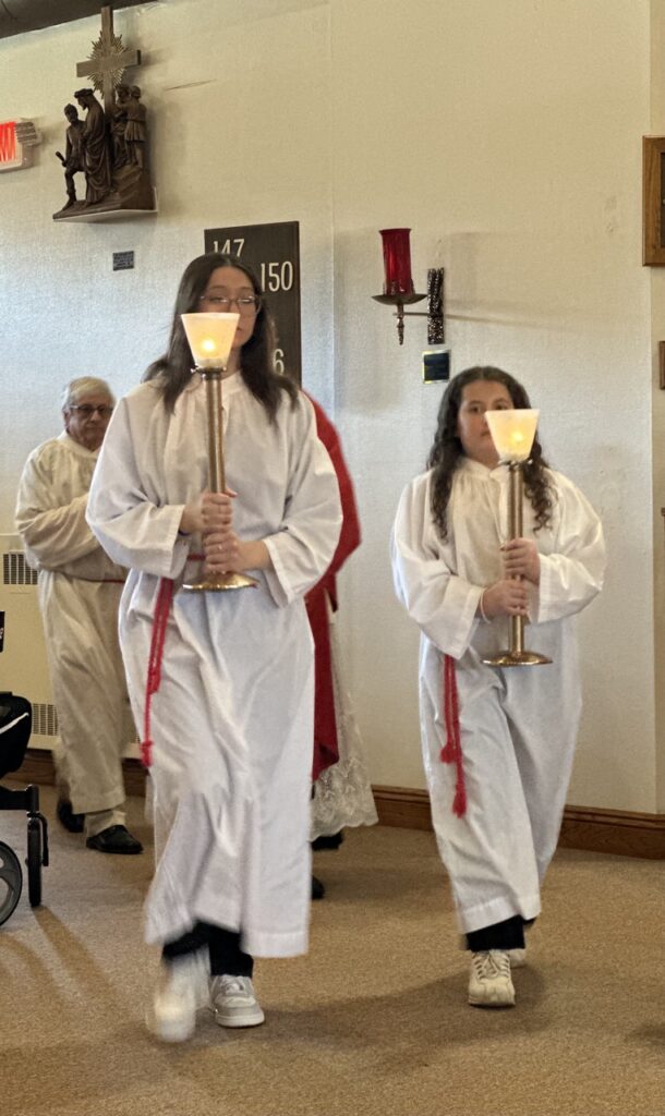 Altar servers process at Our Lady of Peace Parish in Ashtabula during Good Friday. Photo by Marilou McClimans.