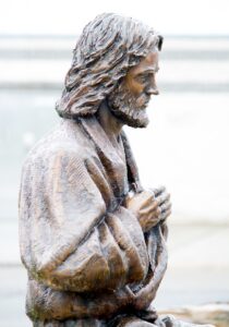 Image of statue depicting Jesus at table. Photo by Courtney Poullas