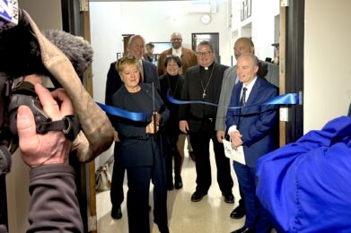 image of cameramen filming ribbon cutting at Respite of Hope
