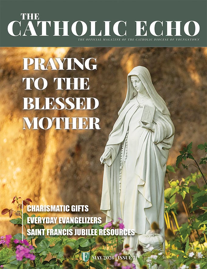 Cover featuring statue from Our Lady of Lourdes Grotto in Mogadore.
