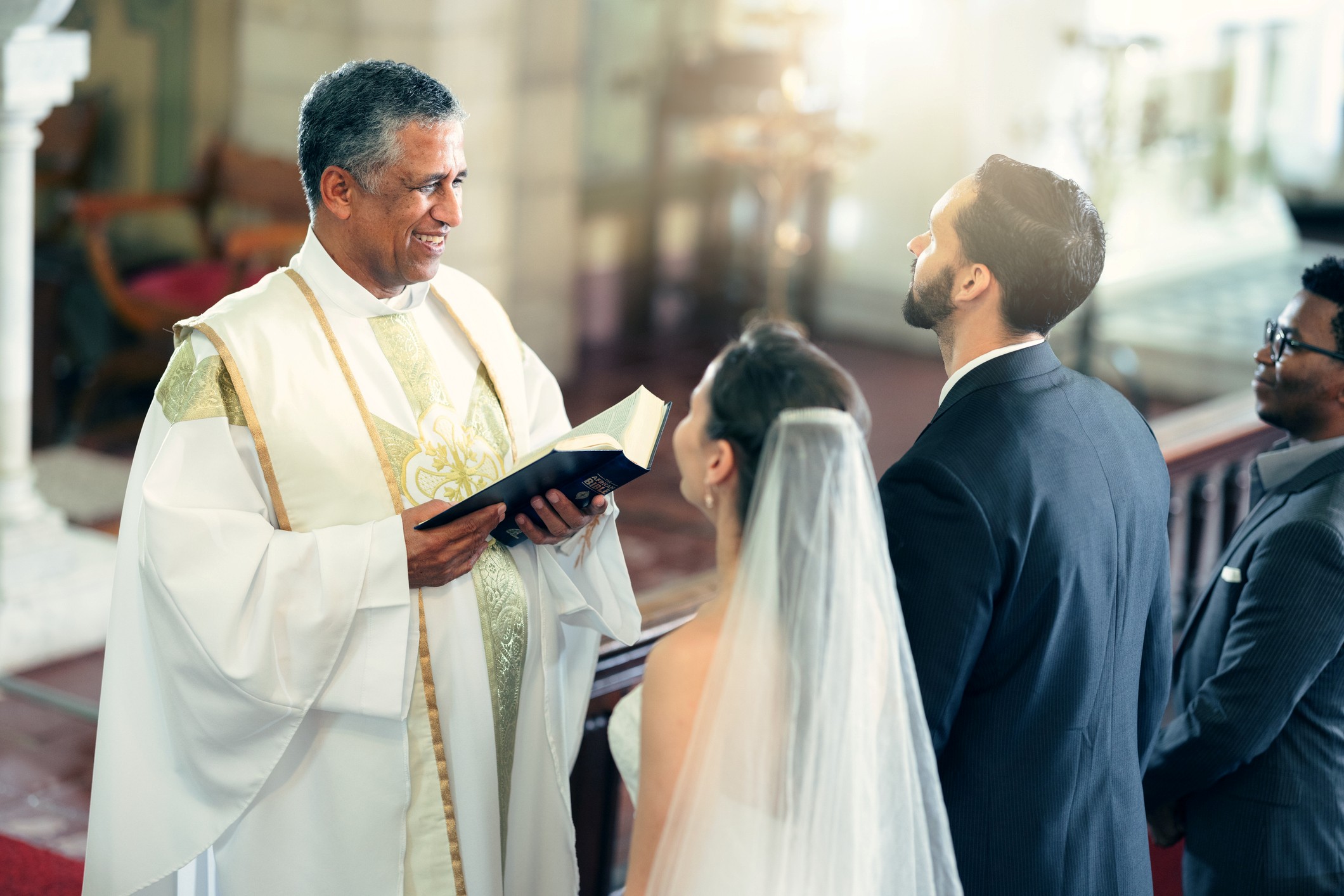 A couple getting married in a Catholic wedding