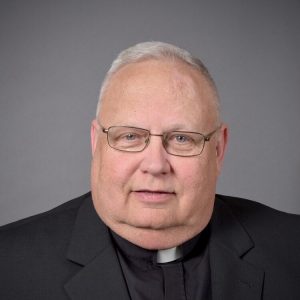 headshot of father brienz
