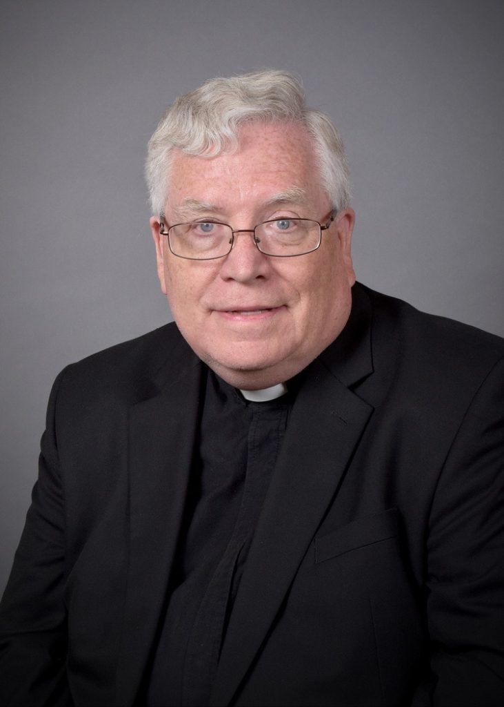 Headshot of Father Madden