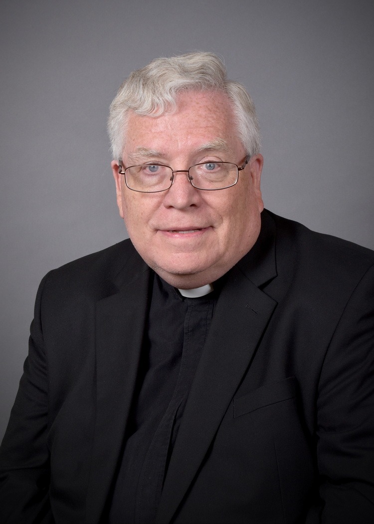 Headshot of Father Madden