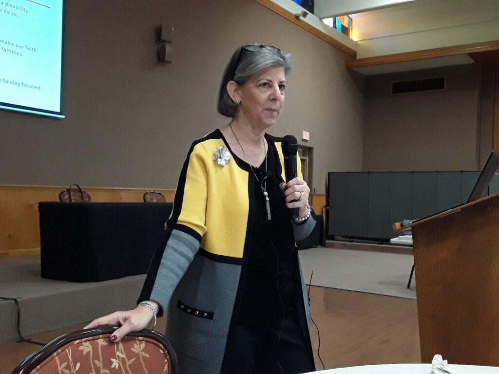 Charleen Katra gives a presentation in a conference room at St. William Catholic Church. 