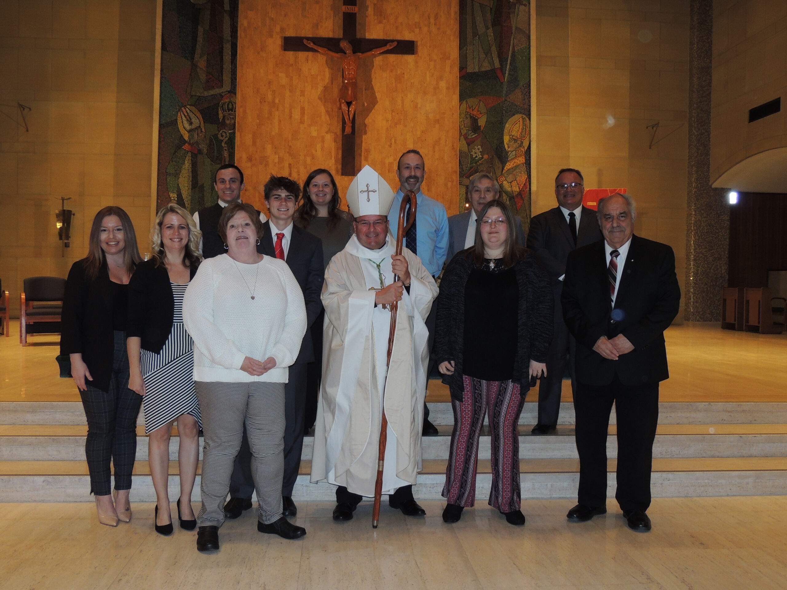 Eleven confirmands pose with Bishop Bonnar at St. Columba Cathedral