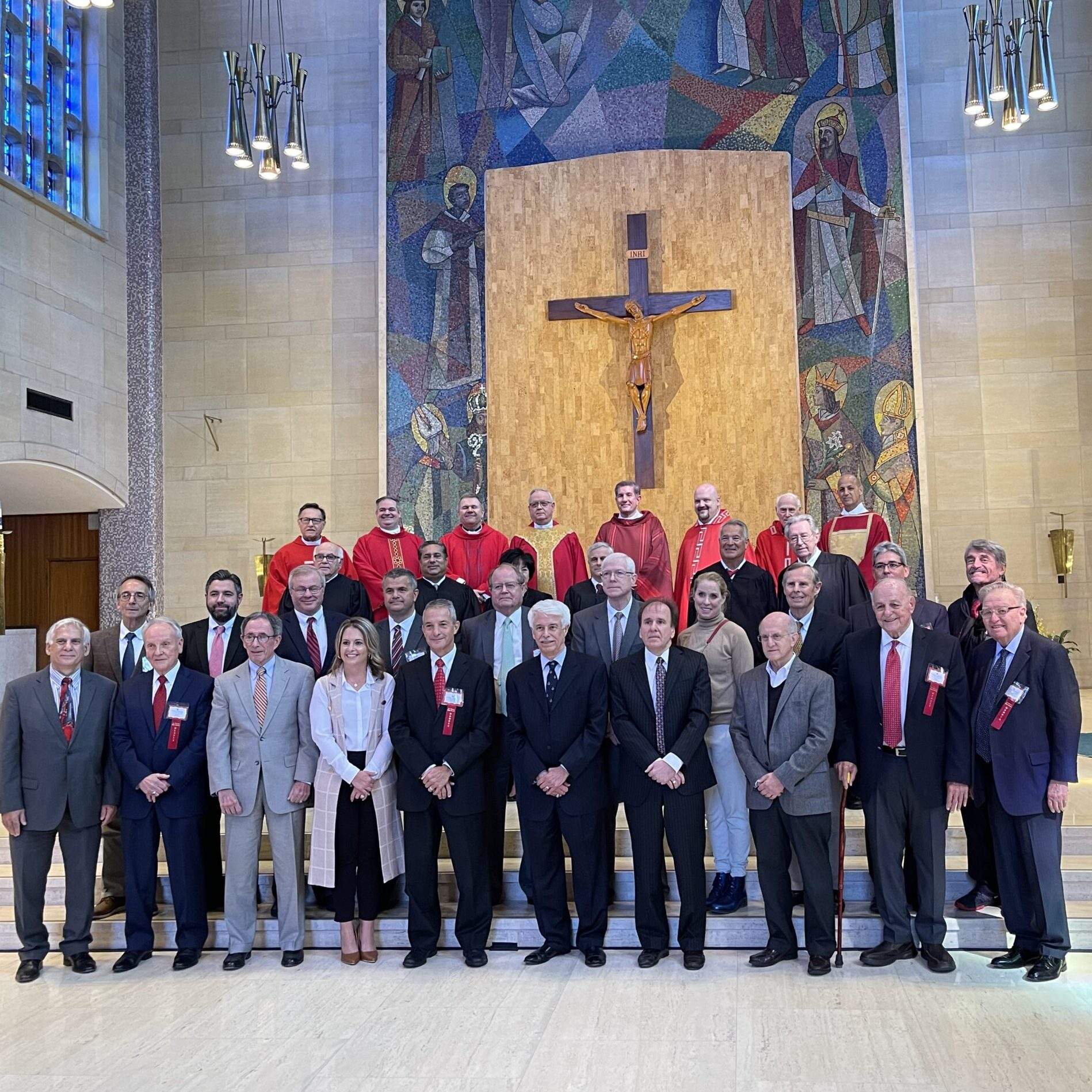 Members of the Legal & Judicial professions gather and smile in St. Columba Cathedral, Youngstown, Ohio for the Annual Red Mass