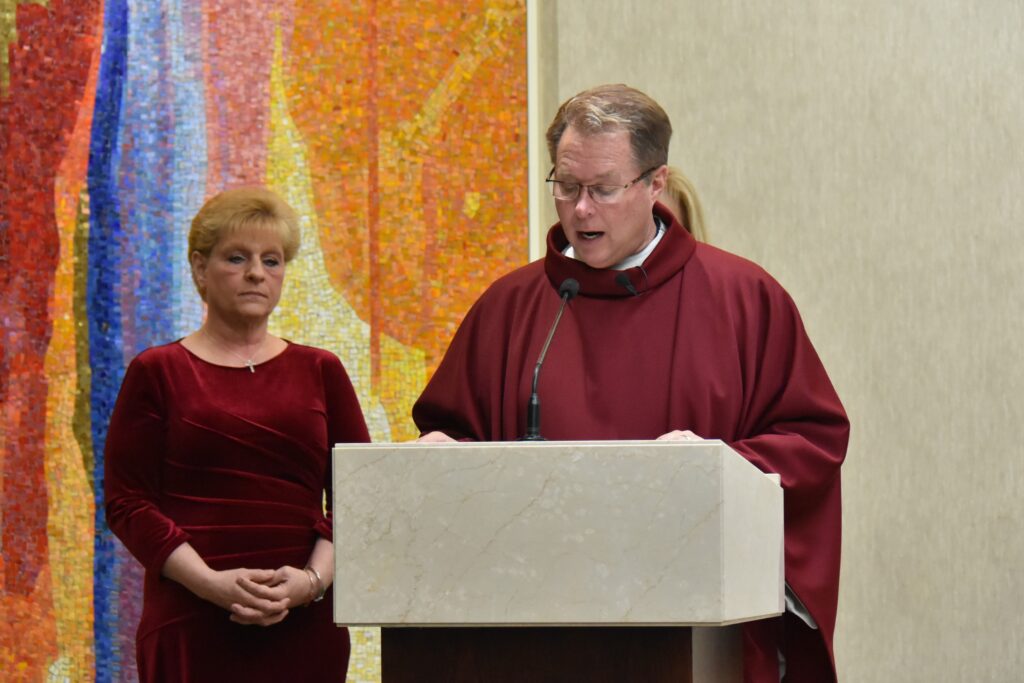 Fr. Balash reads the Gospel at St. William Parish