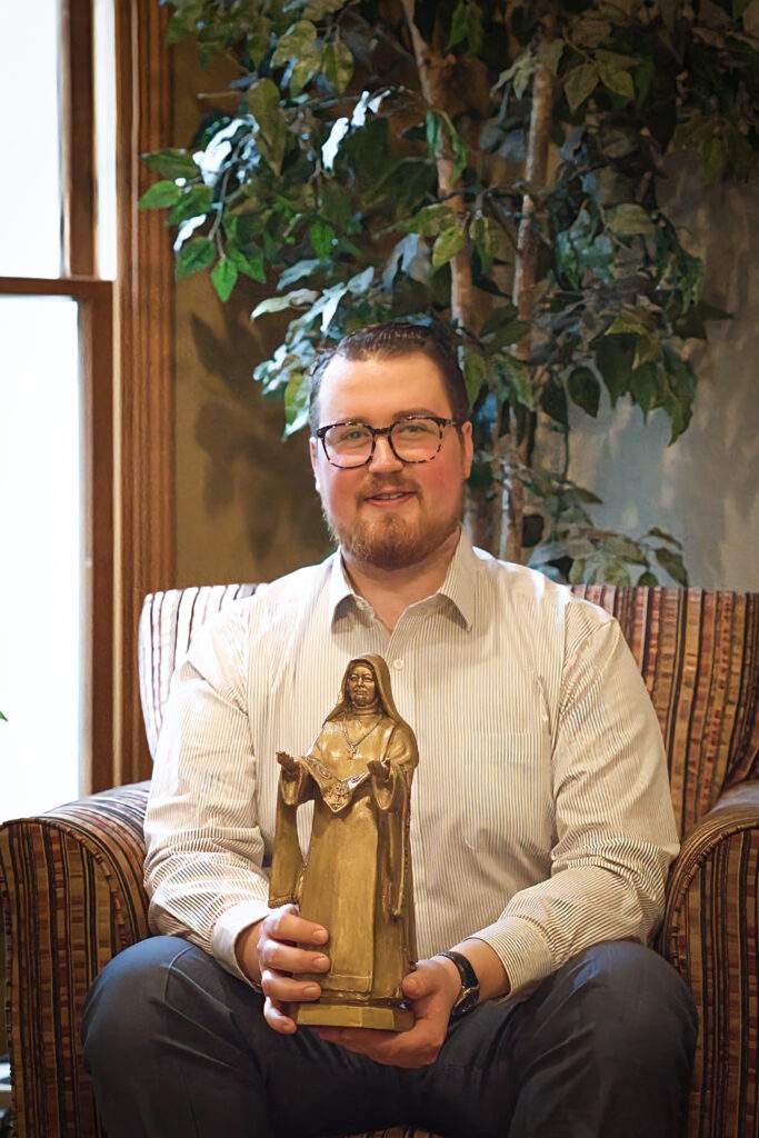 Jacob holds statue of Blessed Mother Maria Teresa Casini