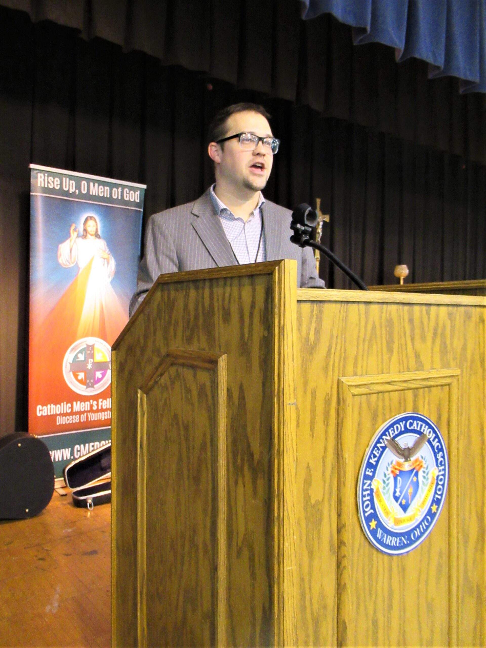 Dr. Ben Safranski speaks at the podium during the Youngstown Catholic Men's Fellowship Conference.