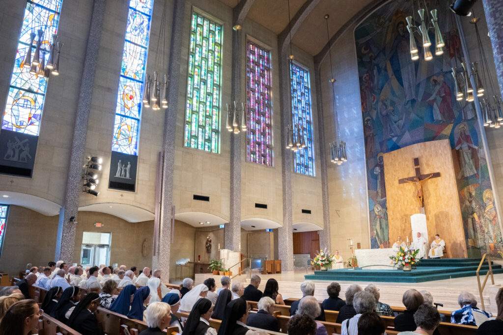 Full pews at 80th anniversary Mass