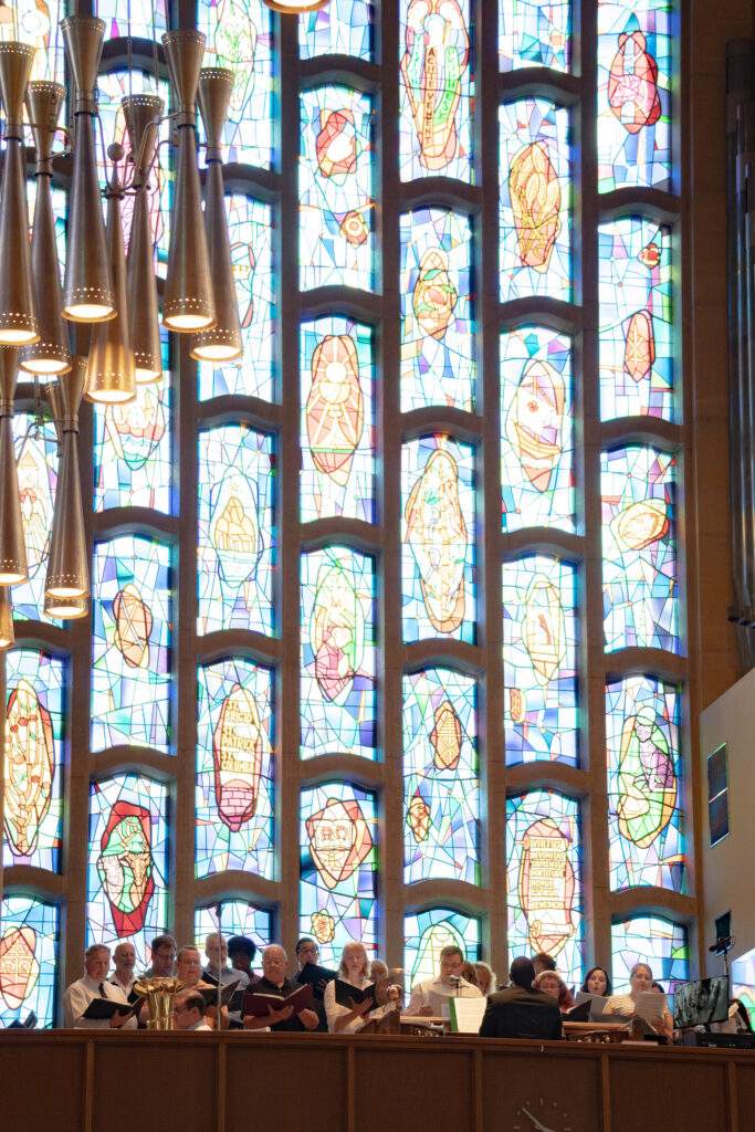 View of St. Columba Cathedral choir from below, showing stained glass windows