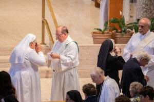 Nuns receive communion