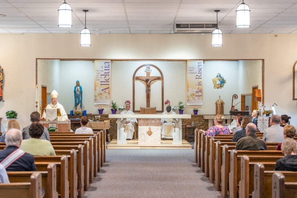 Bishop Bonnar delivers homily at altar blessing Mass at Sacred Heart Parish in Rock Creek. Photo by Brian Keith