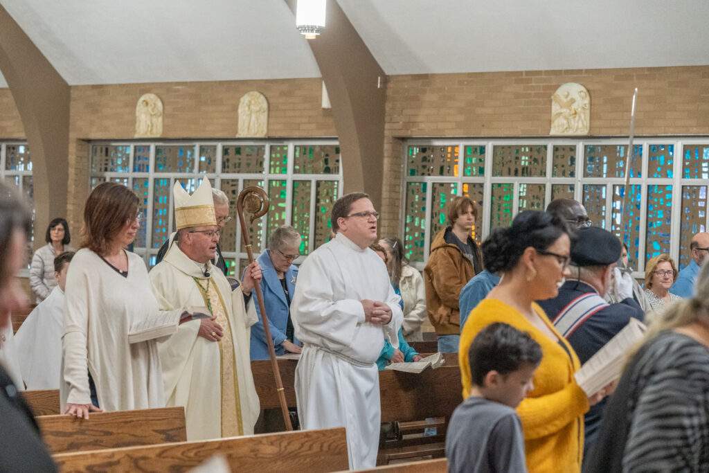 Bishop Bonnar walks in procession at St. Mary Parish in Orwell, during their altar blessing Mass on May 7. Photo by Brian Keith