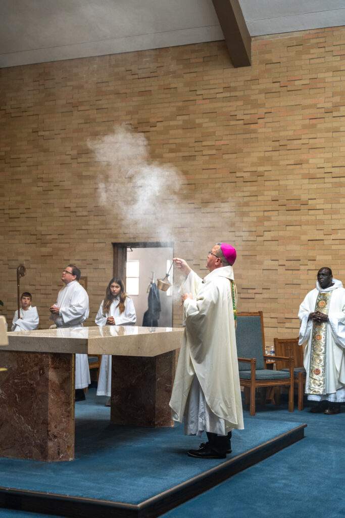 Bishop Bonnar incenses the altar at St. Mary Parish in Orwell. Photo by Brian Keith