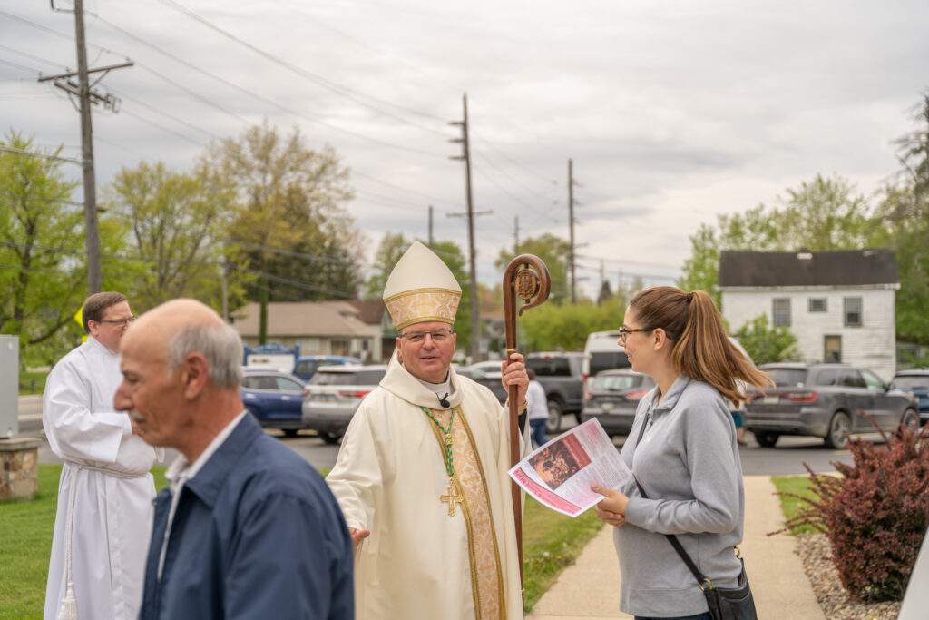 Bishop Bonnar greets parishioners after Mass at St. Mary Parish in Orwell. Photo by Brian Keith