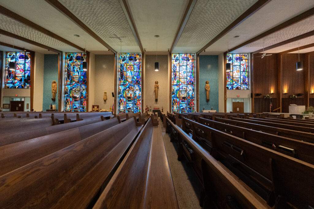 St. Elizabeth Ann Seton Parish in Warren displays items from Sts. Cyril and Methodius Church (closed in 2022), which can be seen beneath their stained glass windows in this photo.