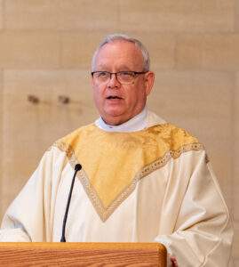 Monsignor Robert Siffrin stands at the pulpit at St. Columba Cathedral.