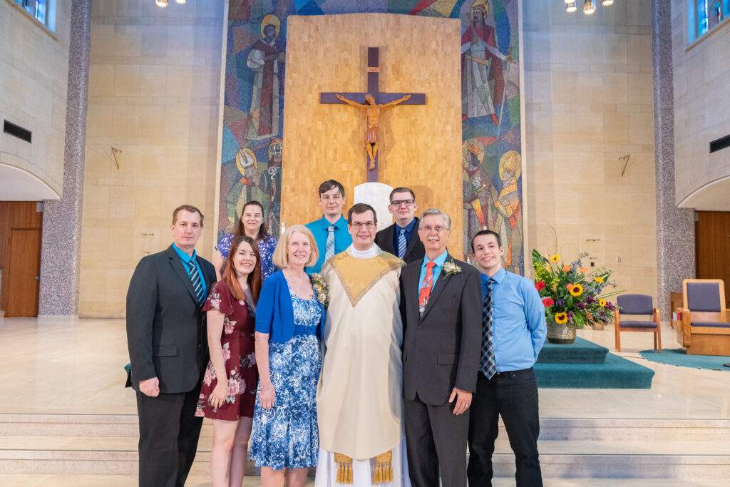 Father Rovnak stands with his family