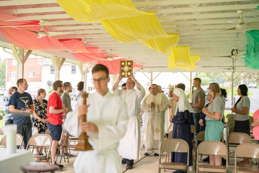 priests and deacons walk in procession at World Youth Day
