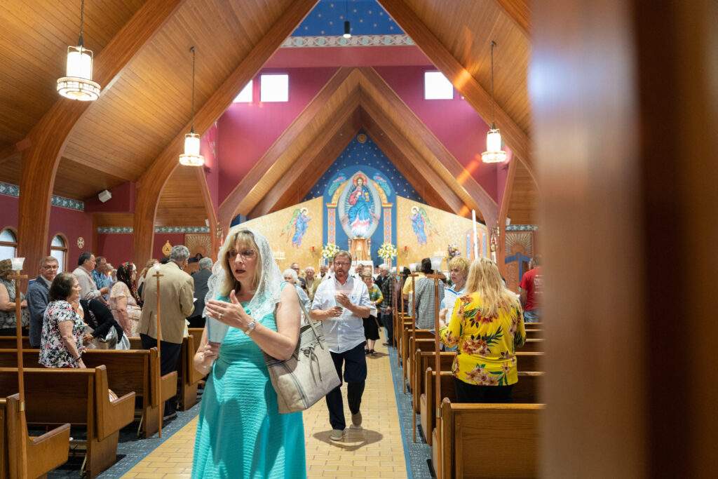 Attendees process out of the church