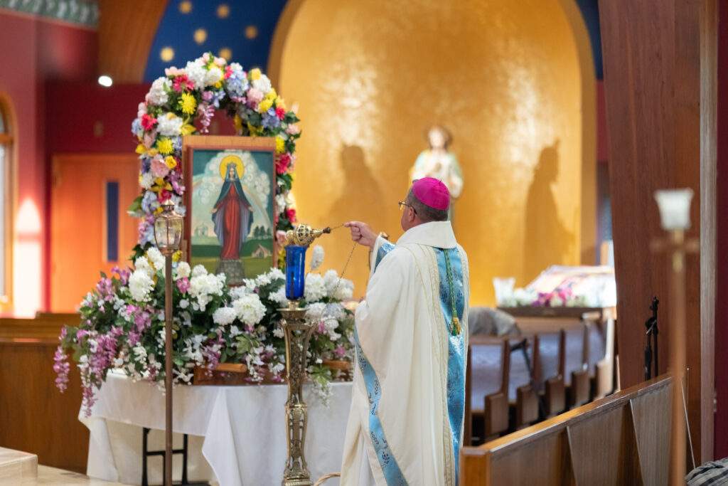 Bishop Bonnar incenses the image of Mary