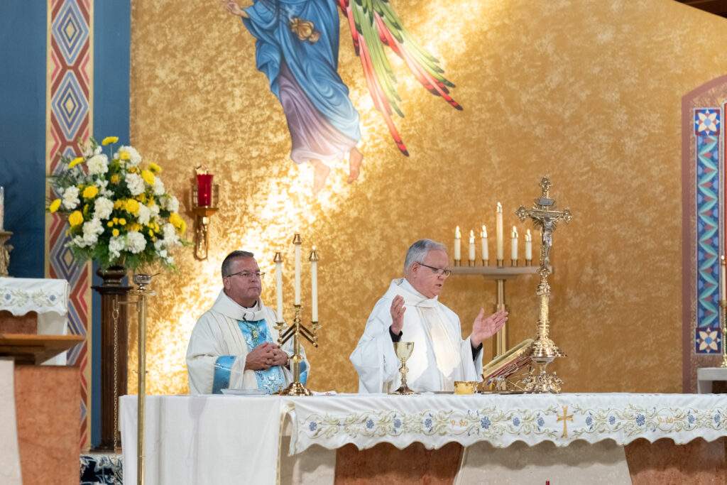 Monsignor Siffrin performs the Eucharistic prayers